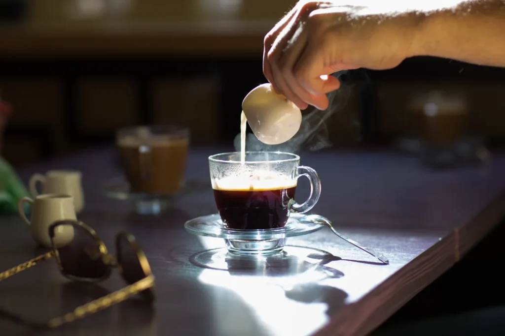 Espresso being poured at a cafe counter